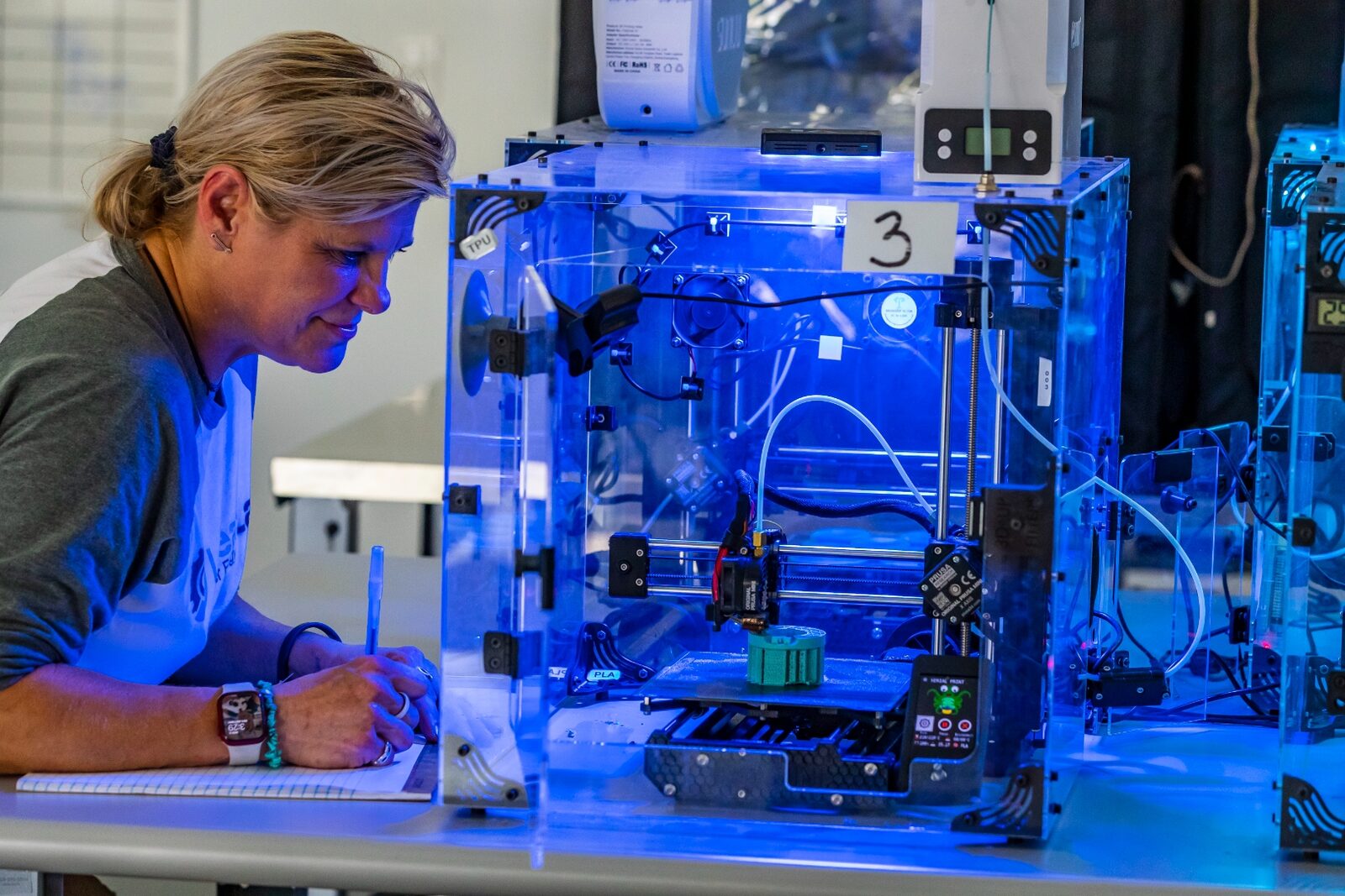 Linear Labs engineer monitoring 3D printing for motor components