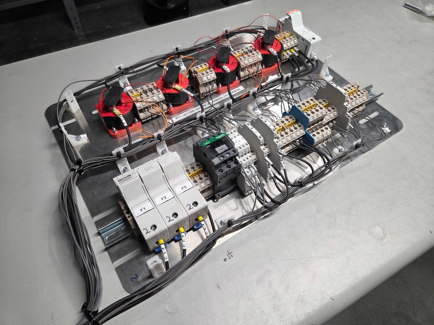 Power distribution panel with contactors, fuses, and current transformers