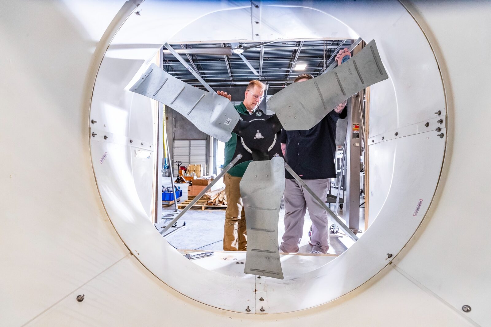 Linear Labs team members inside a turbine hub